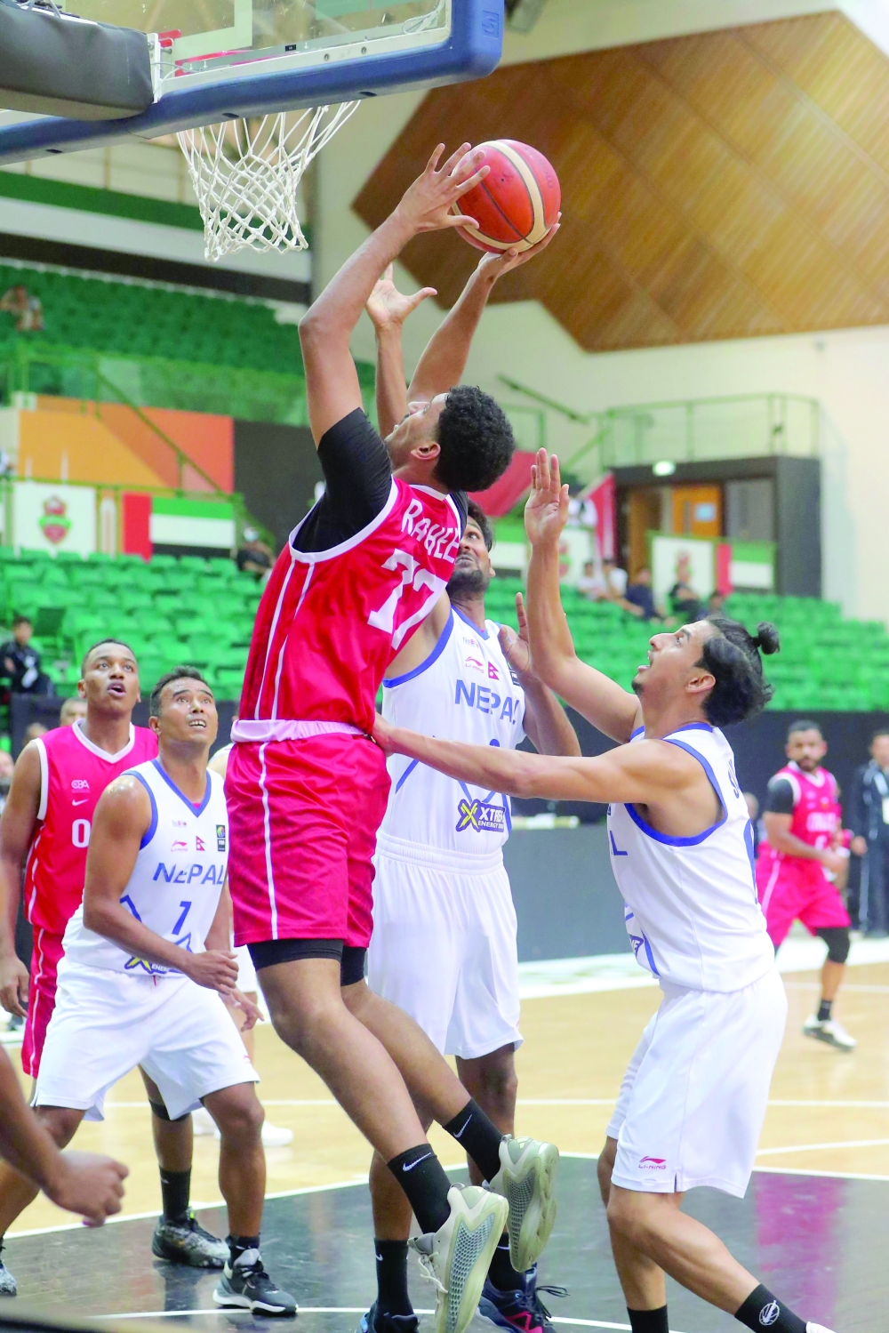 An Oman player attempts a basket against Nepal during their final Fiba Asia Cup 2029 Pre-Qualifiers match in Dubai. — Ammar al Musafir