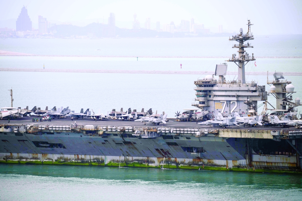 US aircraft carrier USS Abraham Lincoln heads towards Laem Chabang Port, near the city of Pattaya. — AFP