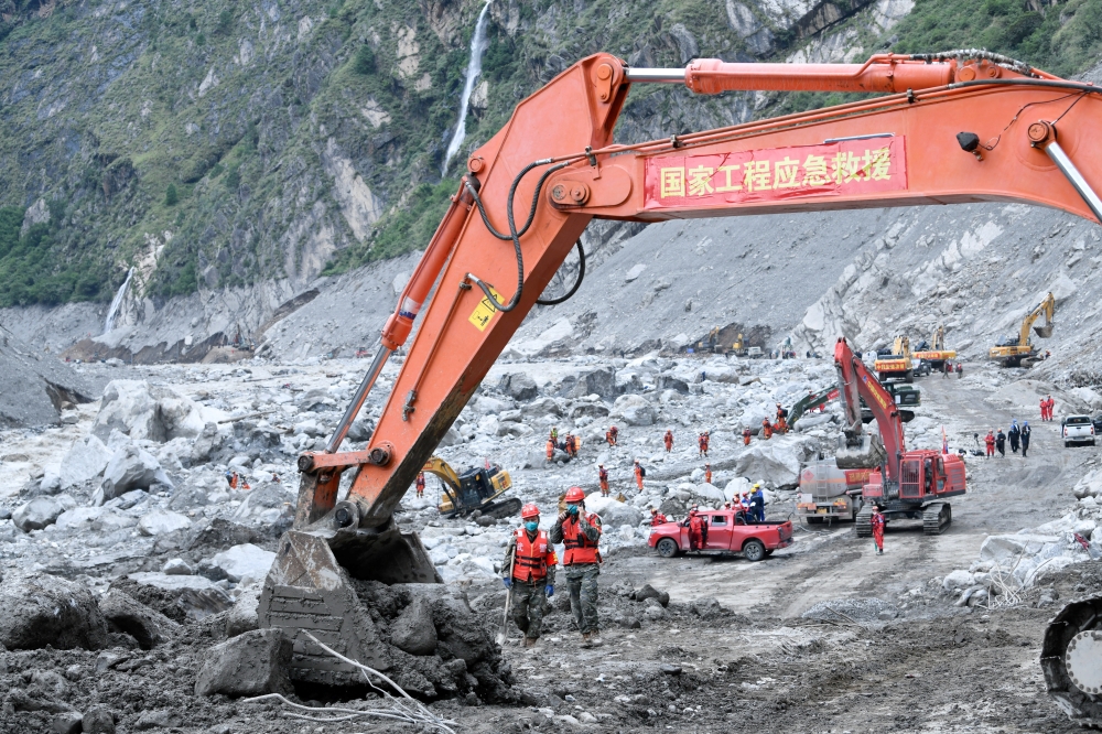 Rescue workers conduct search and rescue operations at the core disaster-hit area at Gyirong Port following the August 26 mudslide, in Shigatse