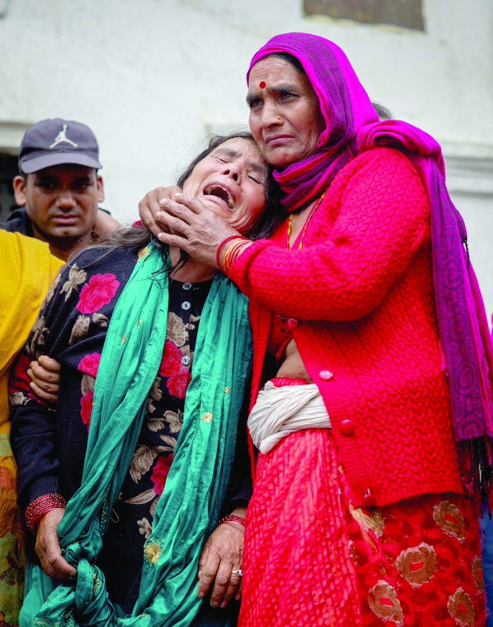 The wife of Bishi Pandey, who lost his life in the deadly flash floods and a mudslide, mourns during his cremation ritual using an effigy, as his body remains missing, on the premises of Pashupatinath Temple in Kathmandu. - Reuters