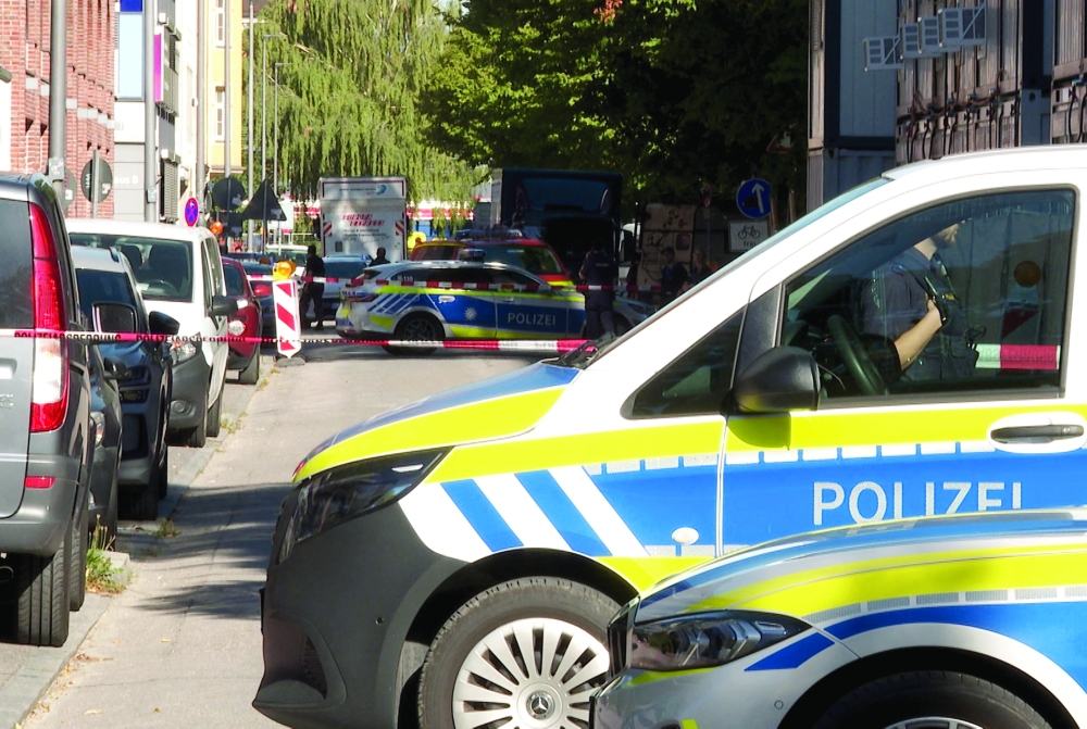Police secure the area after a suspected politically motivated arson attack on a construction site outside the headquarters of defence tech firm Rohde & Schwarz in Munich. - Reuters