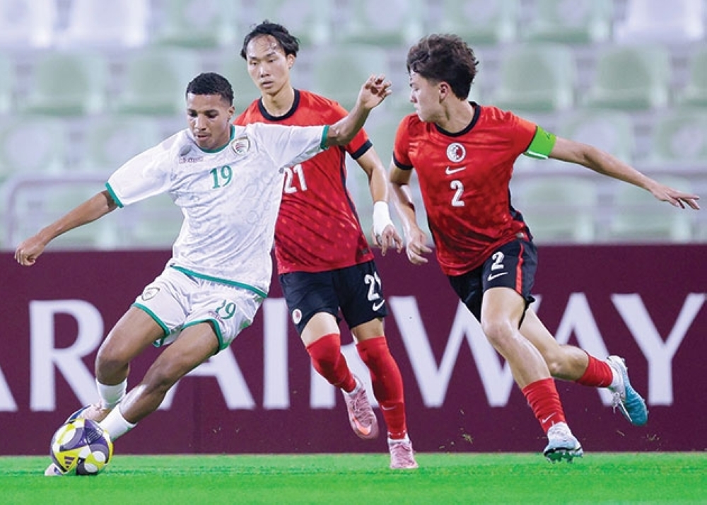 Oman U20 players celebrate their qualification for the Asian finals following the 1-1 draw in Doha.