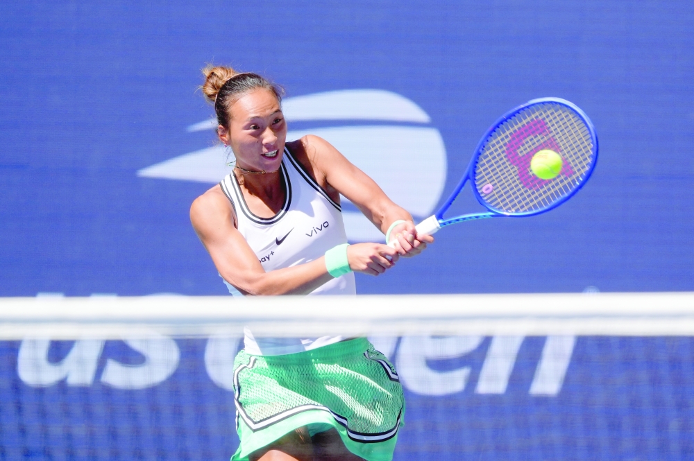 China's Qinwen Zheng in action during her US Open Round of 16 match against Poland's Iga Swiatek at Flushing Meadows, New York. — Imagn Images