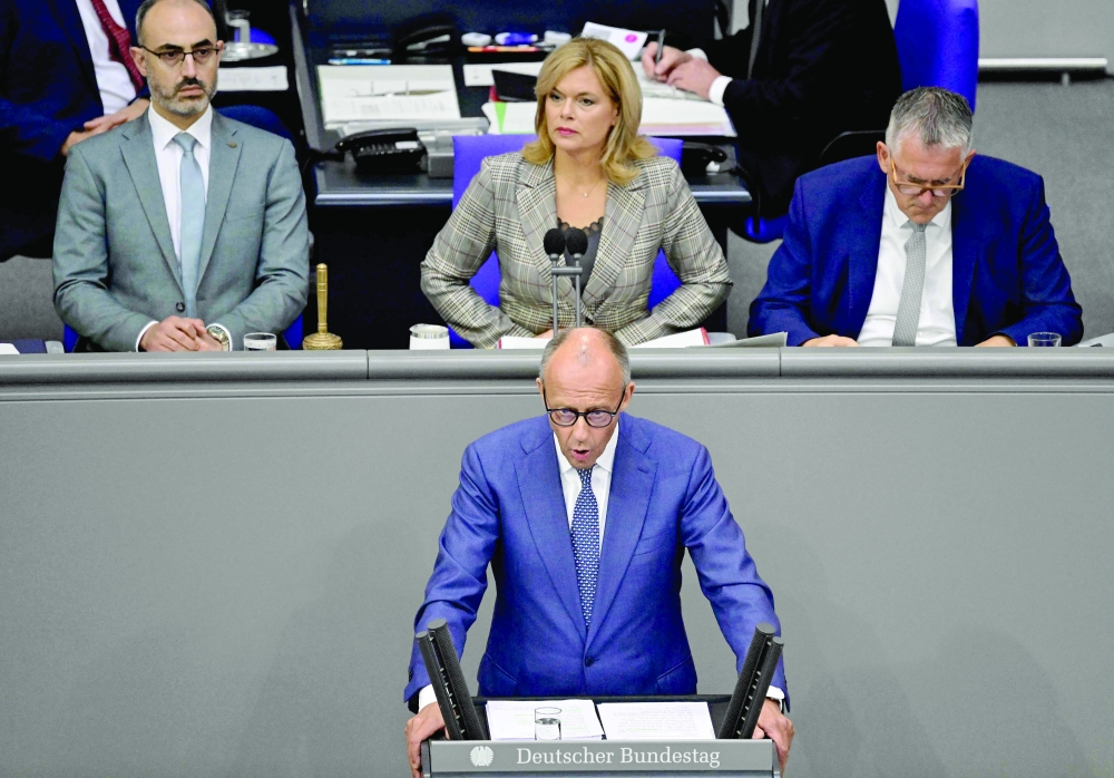 German Chancellor Friedrich Merz (C) delivers his speech at the Bundestag in Berlin. — AFP
