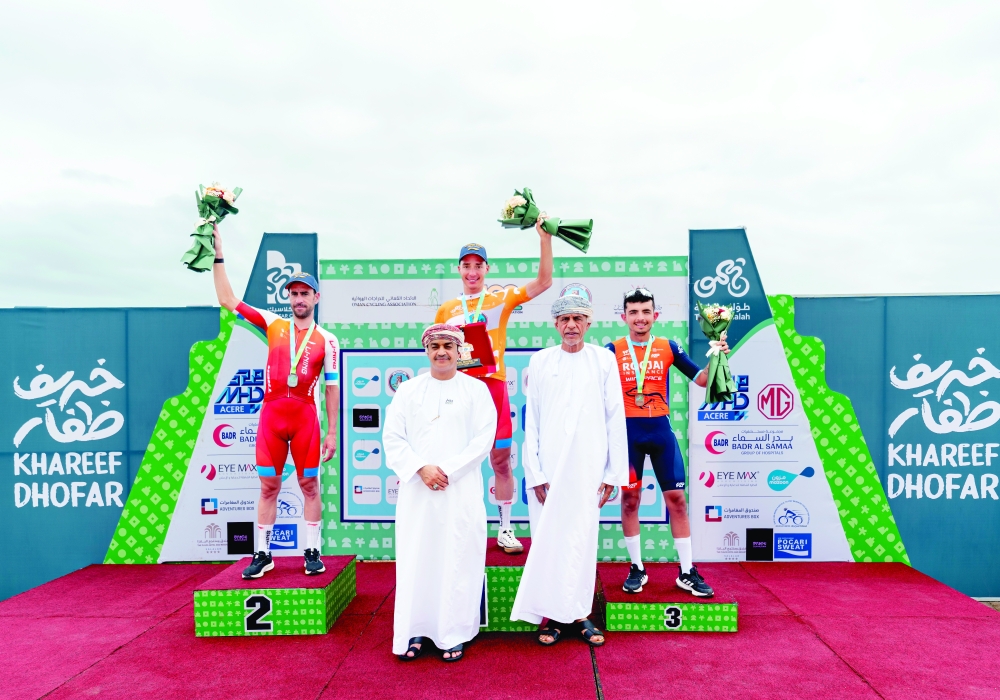 The overall winners of the Tour of Salalah pose on the podium.