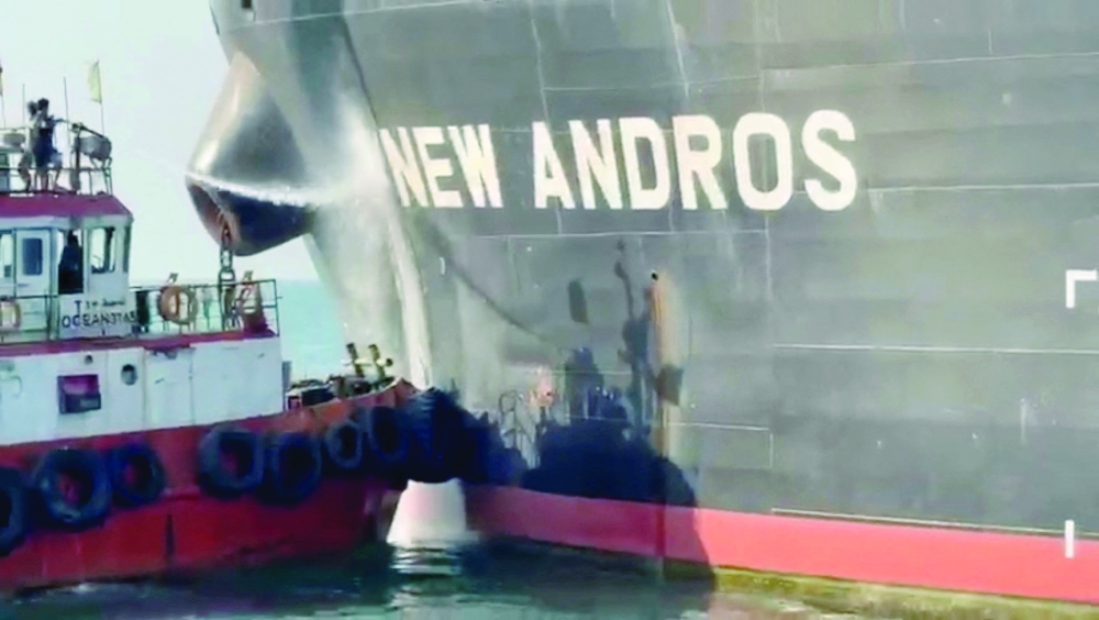Water is sprayed on the oil tanker New Andros, which was struck by a drone in Iraqi territorial waters, on Wednesday. - Reuters