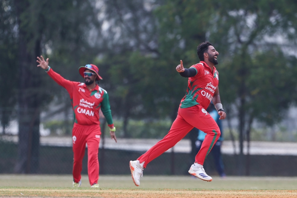 Oman’s Hassnain Shah celebrates taking a wicket against Nepal in the ACC Men’s Premier Cup semifinal on Thursday.
