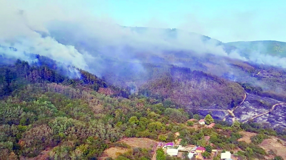  An aerial view of wildfire burning near the village of Dimovtsi, Bulgaria.  