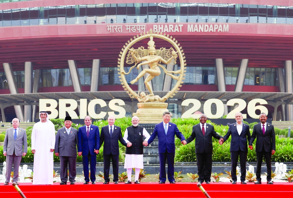 Leaders pose for a family photo during the BRICS summit in New Delhi, India. — Reuters