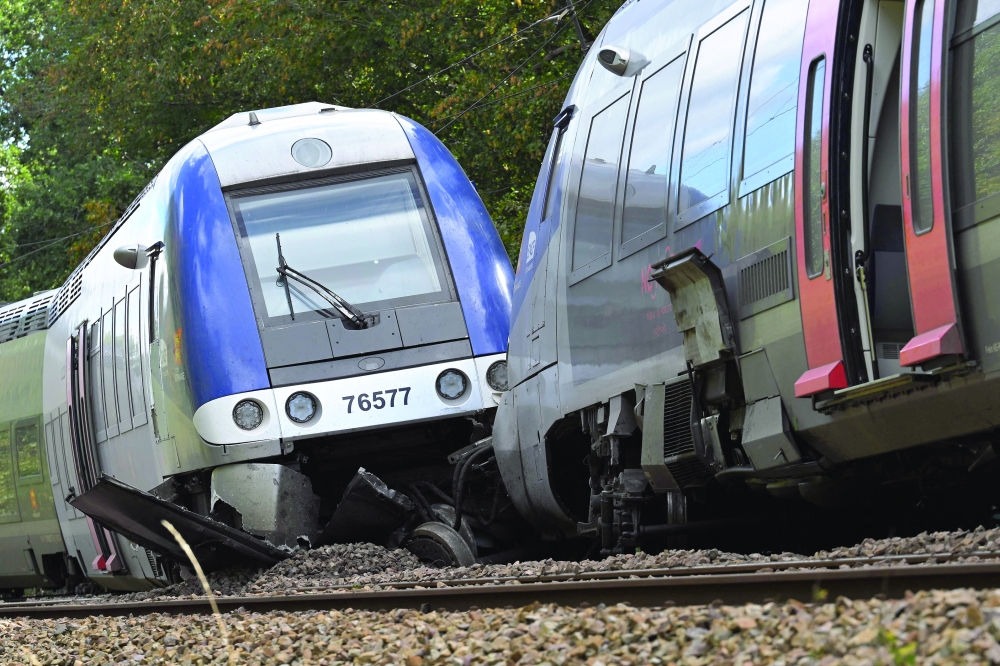 A derailed train carriage in Cleon, northwestern France, the morning after the incident. - AFP