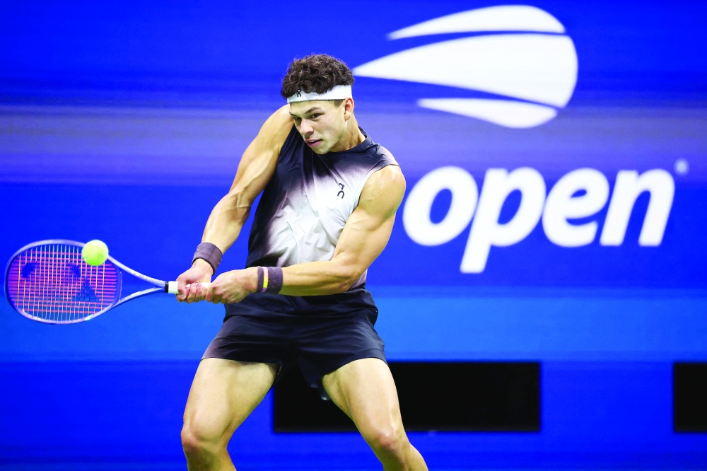 USA's Ben Shelton returns the ball to USA's Frances Tiafoe during the men's singles semi-final tennis match on day thirteen of the US Open tennis tournament at the USTA Billie Jean King National Tennis Center in New York City on September 11, 2026. (Photo by CHARLY TRIBALLEAU / AFP)