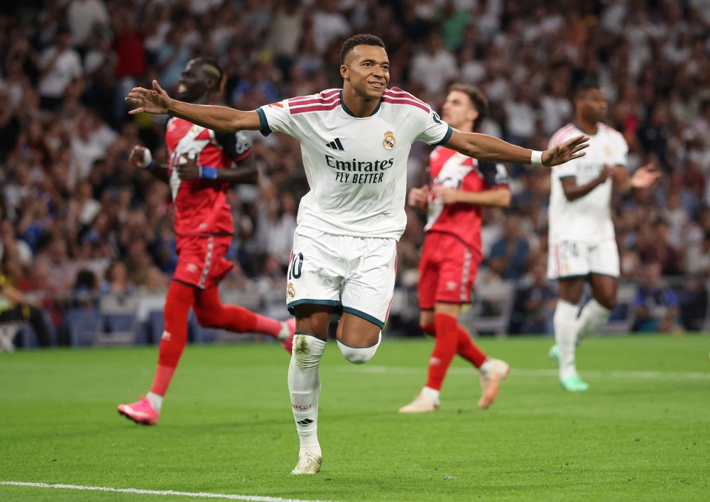   Kylian Mbappe celebrates scoring their first goal