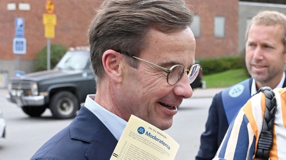 Sweden's Prime Minister Ulf Kristersson arrives to cast his ballot at a polling station in Strangnas near Stockholm. — AFP
