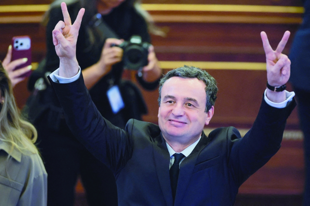 Movement for Self-Determination party leader Albin Kurti flashes a victory sign after being re-elected as prime minister in Pristina, Kosovo. - Reuters