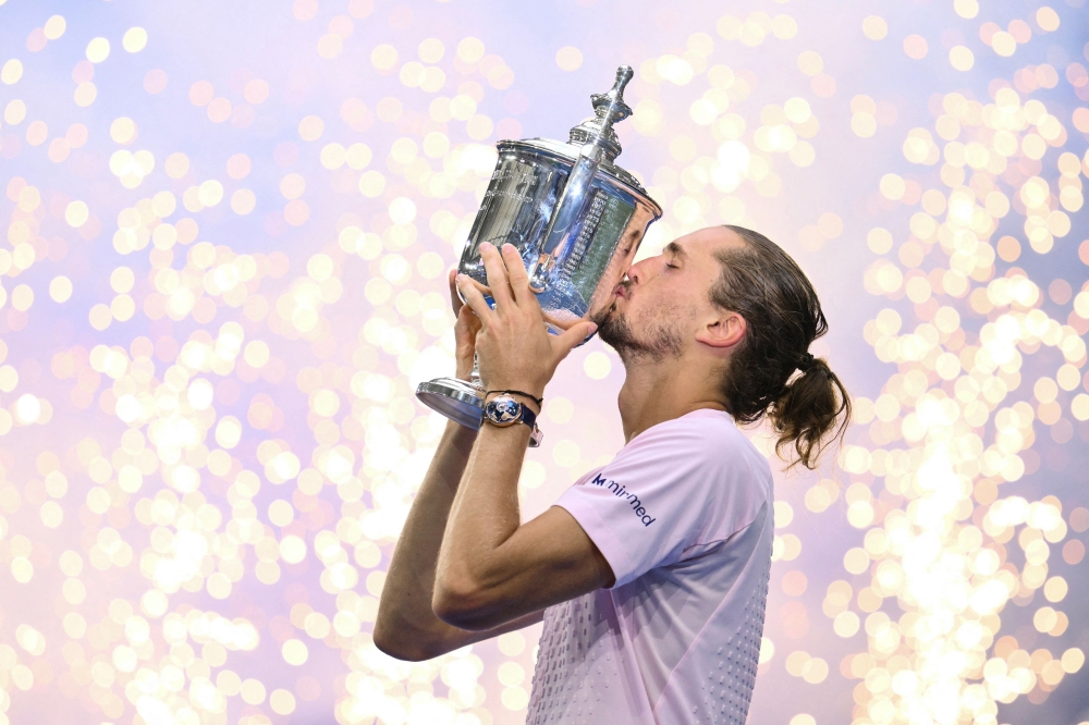 Germany's Alexander Zverev kisses the trophy after defeating USA's Ben Shelton