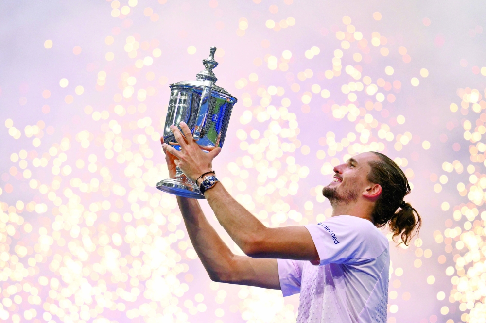 Germany's Alexander Zverev holds the trophy after defeating USA's Ben Shelton in the men's singles final tennis match on day fifteen of the US Open tennis tournament at the USTA Billie Jean King National Tennis Center. — AFP