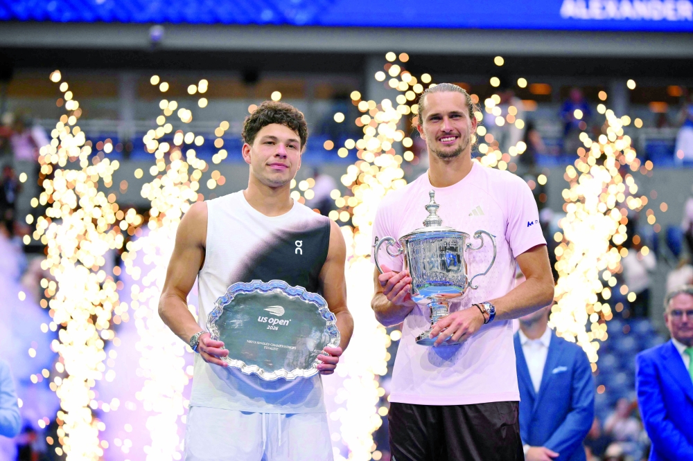 USA's Ben Shelton holds the runner-up trophy next to Germany's Alexander Zverev who holds the winner's trophy after the men's singles final tennis match. — AFP