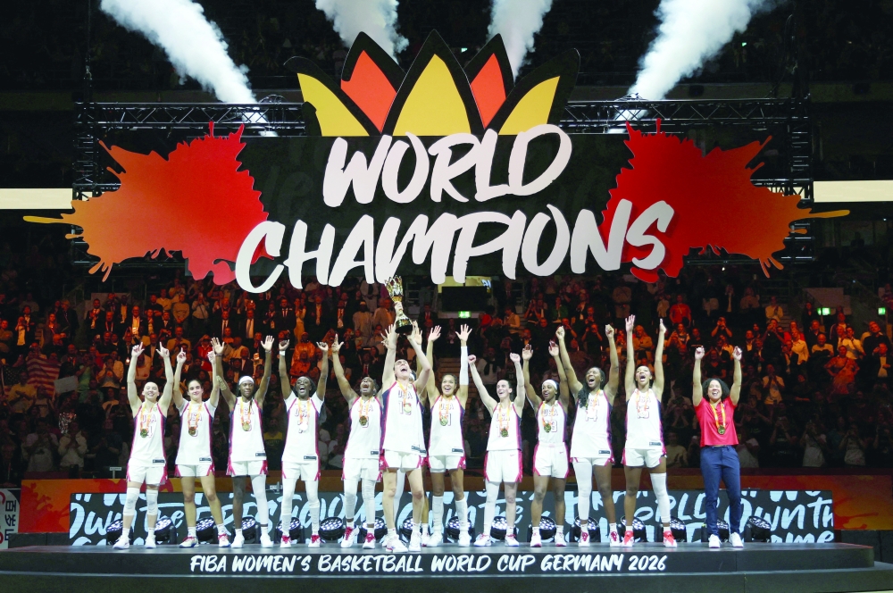 Breanna Stewart of the US lifts the trophy with teammates and head coach Kara Lawson after winning the FIBA Women's World Cup Final. — Reuters