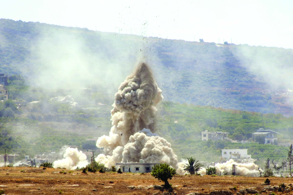 The southern Lebanese village of Al Haniyya shows smoke as it rises from the site of an Israeli air strike that targeted the village of Al Mansouri. — AFP