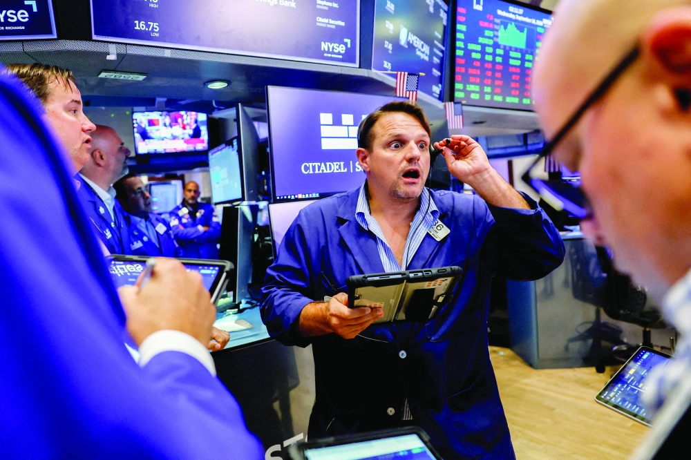 Traders work on the floor of the New York Stock Exchange in New York City, US. - Reuters