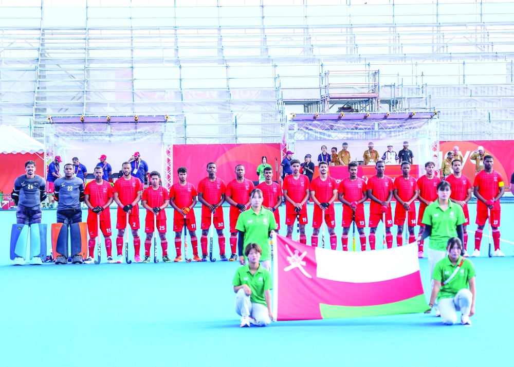 Oman team pose before the match.