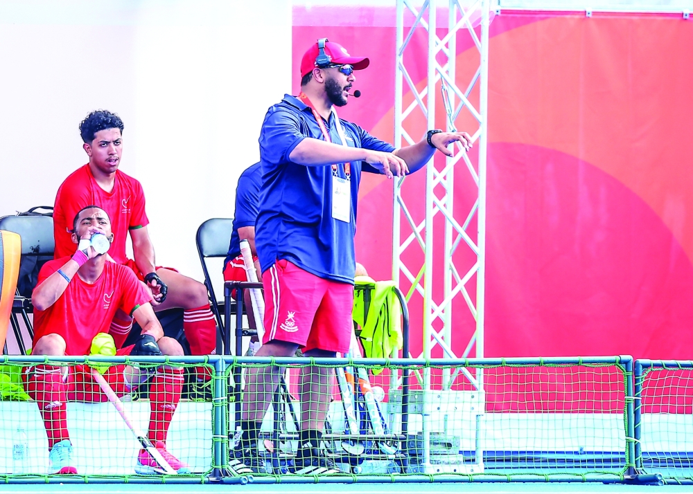 Oman coach Mohammed Houbais during the match against China.