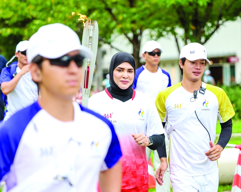 Omani shooter Amina al Tarshi took part in the torch relay at Hisaya Odori Park in Nagoya.