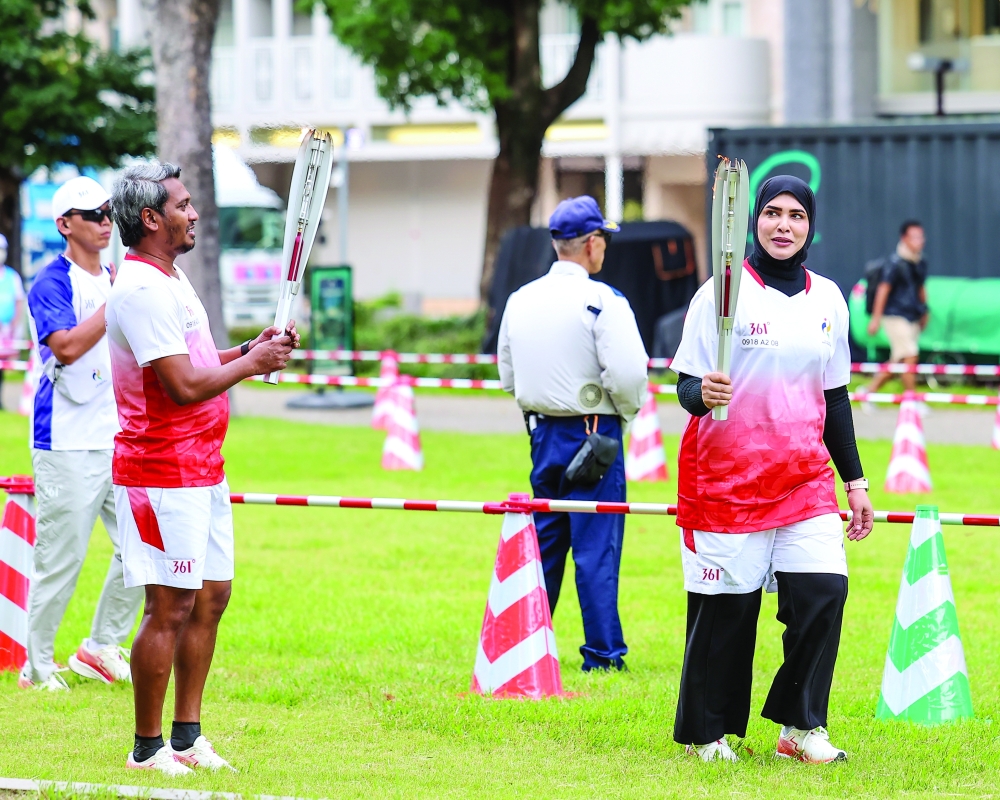 Omani shooter Amina al Tarshi took part in the torch relay at Hisaya Odori Park in Nagoya.