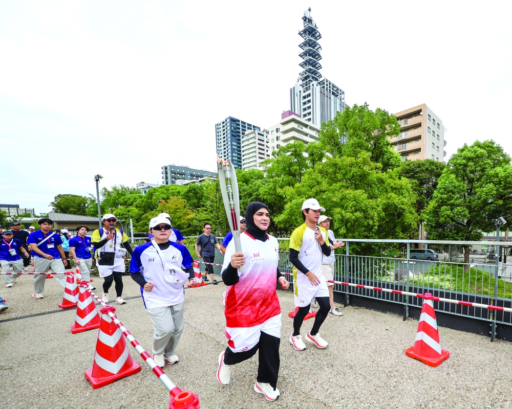 Omani shooter Amina al Tarshi took part in the torch relay at Hisaya Odori Park in Nagoya.
