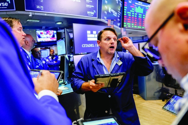 Stocks, bonds dip as central banks hike rates to curb inflation