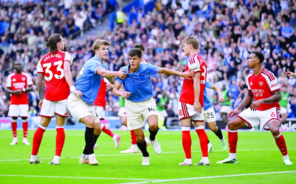 Soccer Football - Premier League - Brighton & Hove Albion v Arsenal - The American Express Community Stadium, Brighton, Britain - September 19, 2026
Brighton and Hove Albion's Chema Andres celebrates scoring their third goal with Luka Vuskovic REUTERS