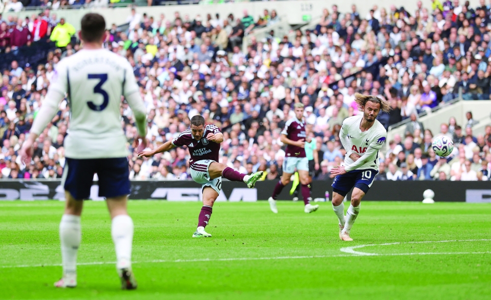 Aston Villa's Emiliano Buendia scores their third goal against Tottenham Hotspur in London. — Reuters