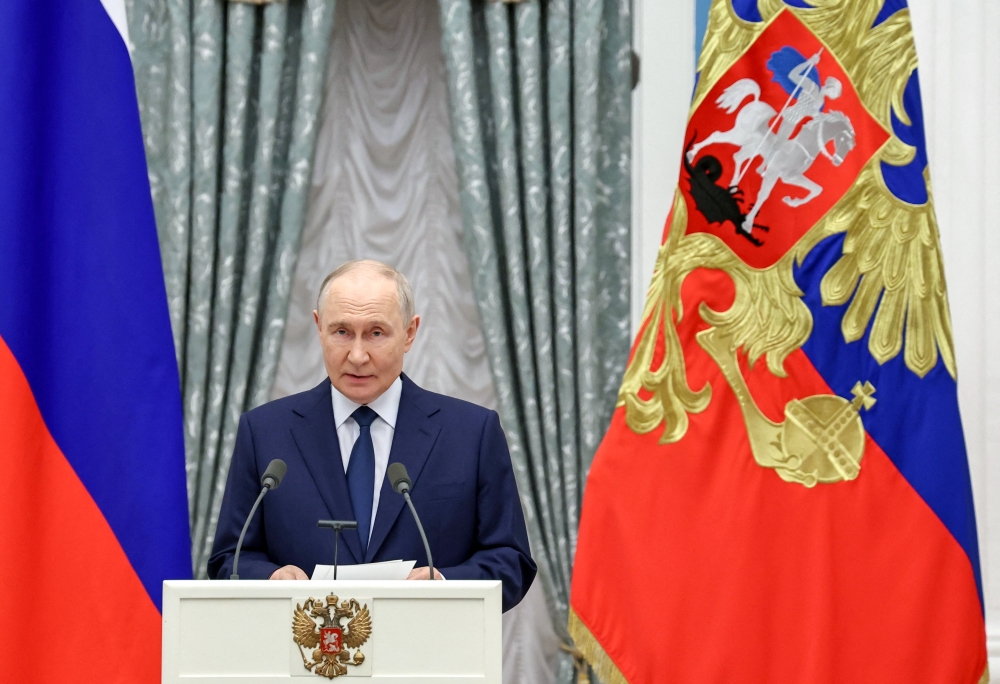 Russian President Vladimir Putin delivers a speech during a ceremony
