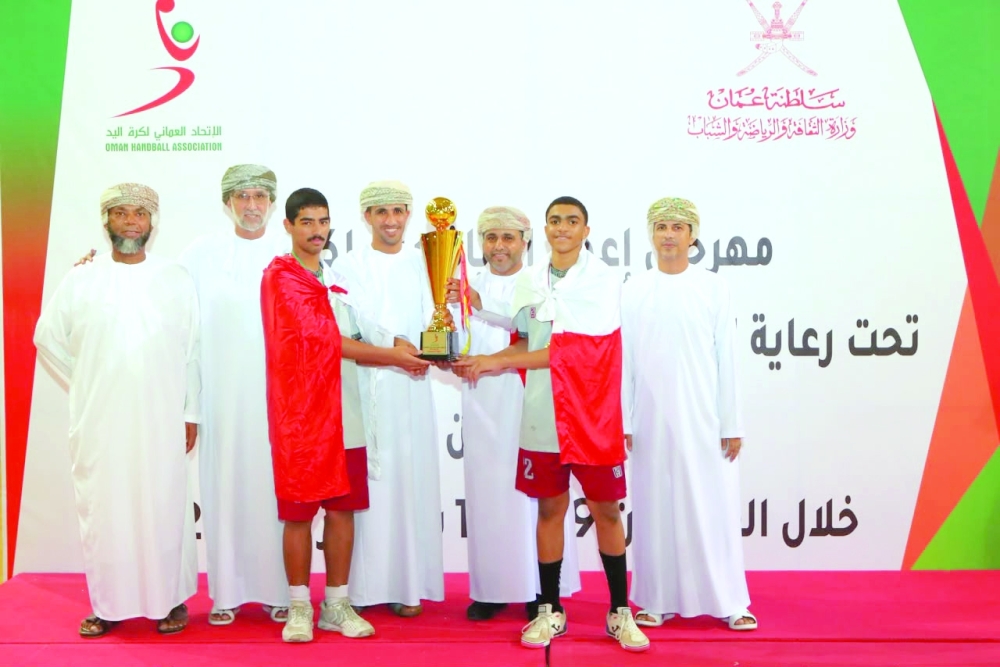 Oman Club players celebrate after being crowned champions of the 2026 Handball Development Centres Festival in Bosher. — Ammar al Musafir