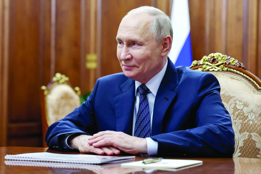 Russian President Vladimir Putin attends a meeting at the Kremlin in Moscow, Russia. — Reuters
