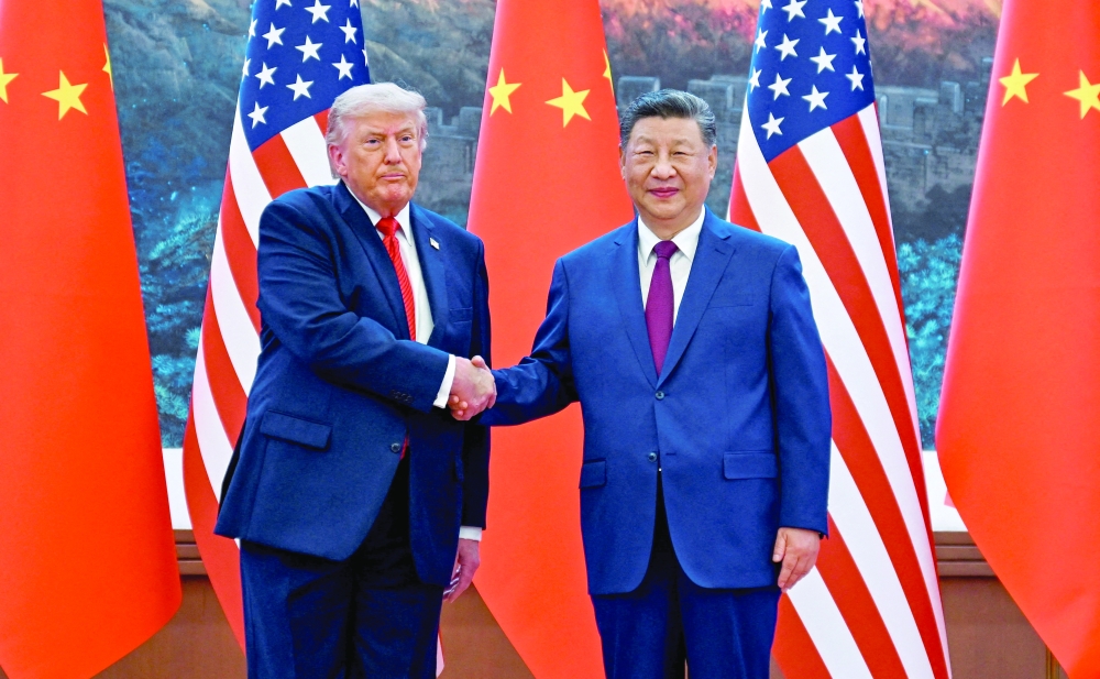 US President Donald Trump greets the President of the People’s Republic of China Xi Jinping at the Great Hall of the People. — Reuters files
