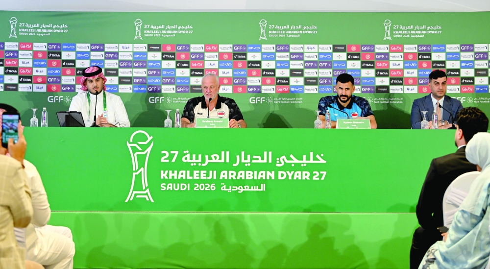 Iraq coach Graham Arnold and player Aymen Hussein during the press conference. — Abdulwahid al Hamadani