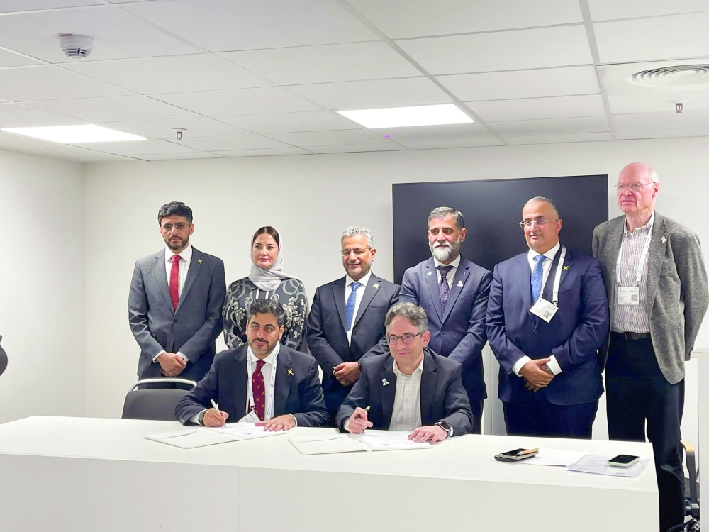 Top officials representing Omani institutions and WWEA at the agreement signing in Hamburg.