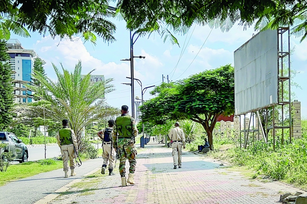 Members of the Tigray People's Liberation Front (TPLF) walk along a main road in Mekelle. — AFP