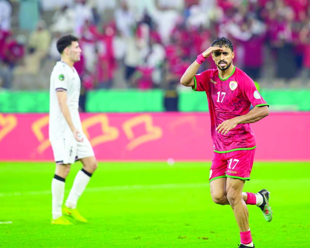 Nasser al Rawahi celebrates after scoring the equalising goal for Oman.