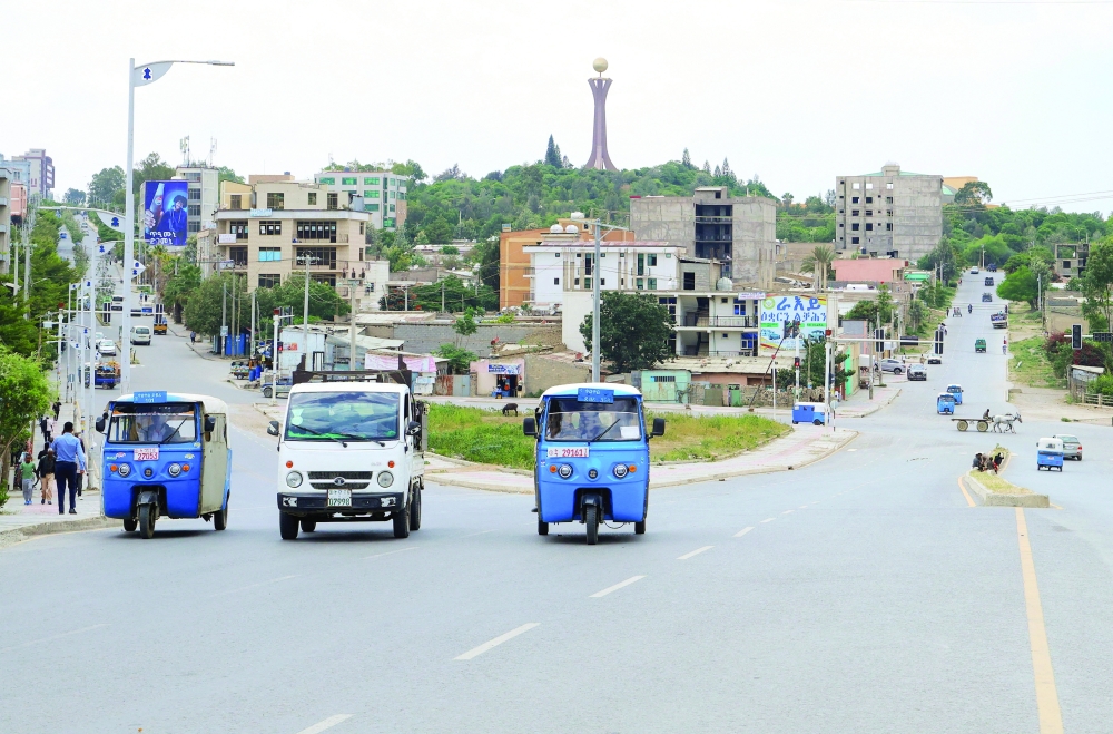
Rickshaw taxis and motorists drive along the street near the Tigray Martyrs monument in Mekelle, Tigray Region, Ethiopia. — Reuters 