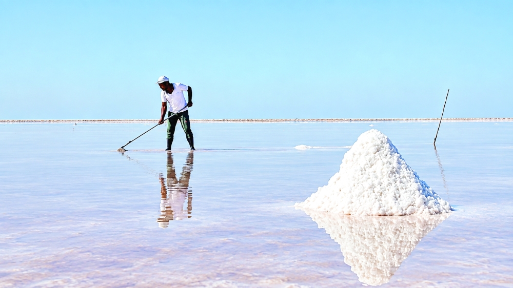 Traditional salt harvesting on the shimmering flats of Shannah.