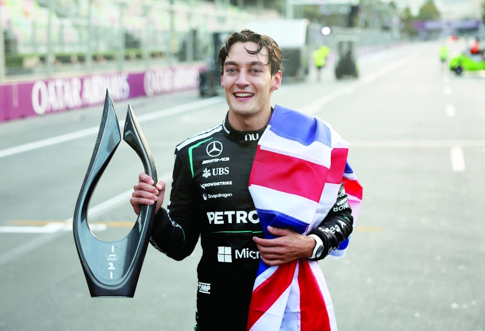 Mercedes' George Russell celebrates with the trophy after winning the race at the Azerbaijan Grand Prix - Baku City Circuit, Baku, Azerbaijan. — Reuters