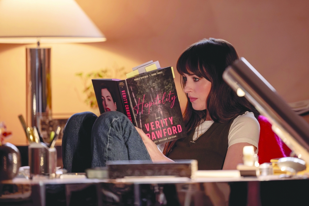 Dakota Johnson as Lowen Ashleigh, a writer who becomes entangled in the disturbing private world of celebrated author Verity Crawford.