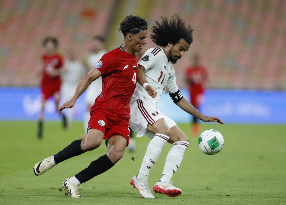 
Qatar's Akram Afif in action with Yemen's Hamza Al Rimi.— REUTERS