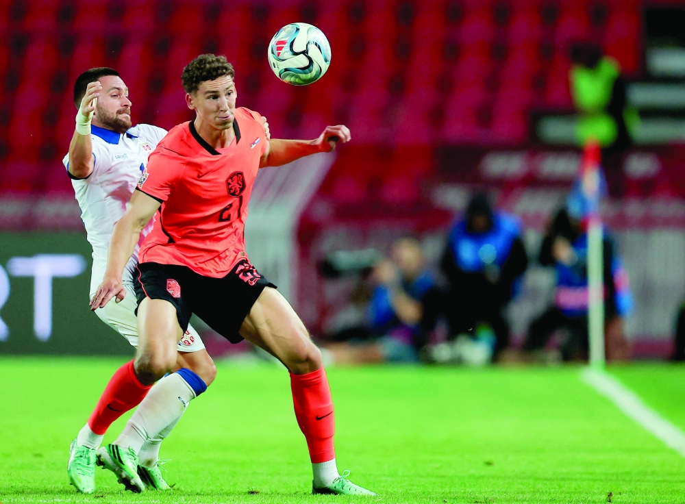 Netherlands' forward Ruben van Bommel fights for the ball with Serbia's midfielder Andrija Zivkovic during the UEFA Nations League Group A2 football match between Serbia and Netherlands at the Rajko Mitic stadium. — AFP