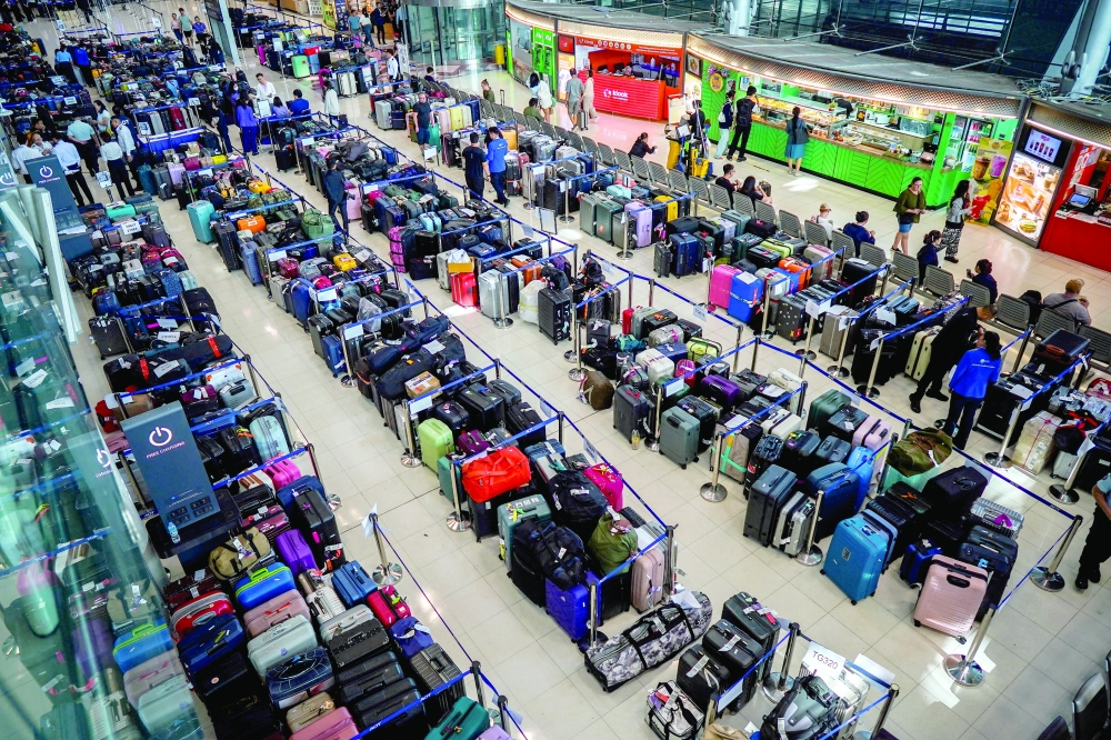 Baggage from Thai Airways flights at Suvarnabhumi International Airport after heavy rain and flooding disrupted the airline's ground operations, in Bangkok, Thailand. — Reuters
