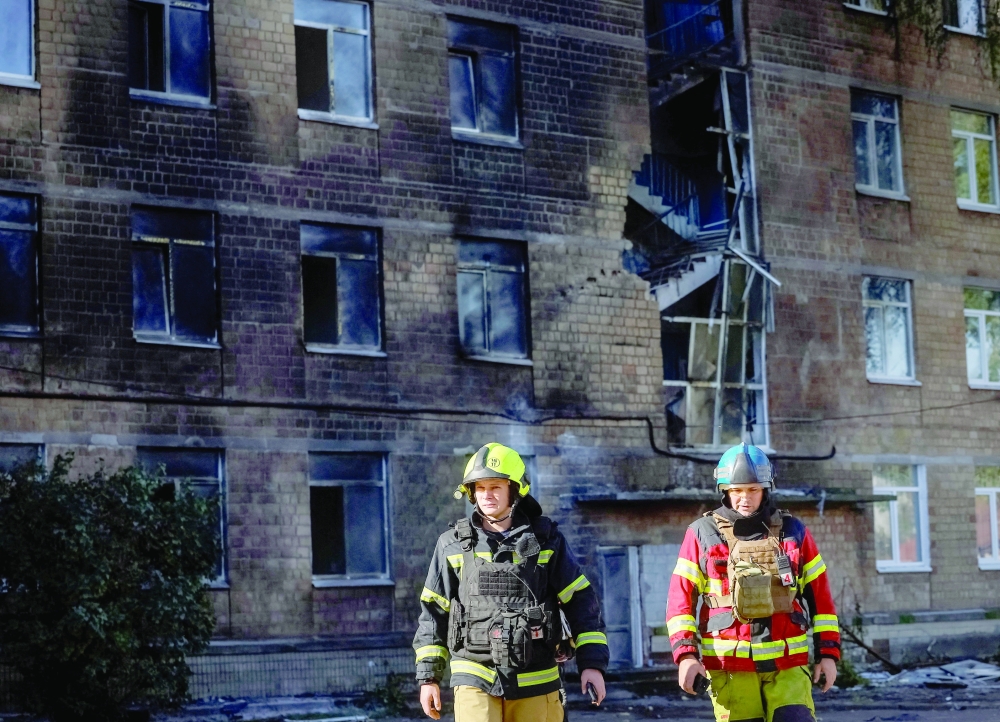 Rescuers work at a site hit by a Russian jet-drone strike in Kyiv, Ukraine. — Reuters