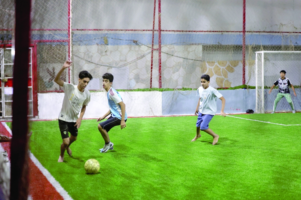 Young people play football during school closures caused by a teachers' sit-in demanding higher salaries in Benghazi, Libya. — Reuters
