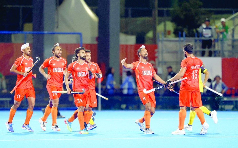 Asian Games - Aichi-Nagoya 2026 - Field Hockey - Men - Gold Medal Match - India v Malaysia - Gifu Prefectural Green Stadium, Kakamigahara, Japan - October 3, 2026
India's Hardik Singh celebrates scoring their third goal with teammates REUTERS/Manami Yamada